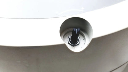 Black hexagonal bolt with textured head set into white plastic housing of beckman coulter microfuge 22r centrifuge