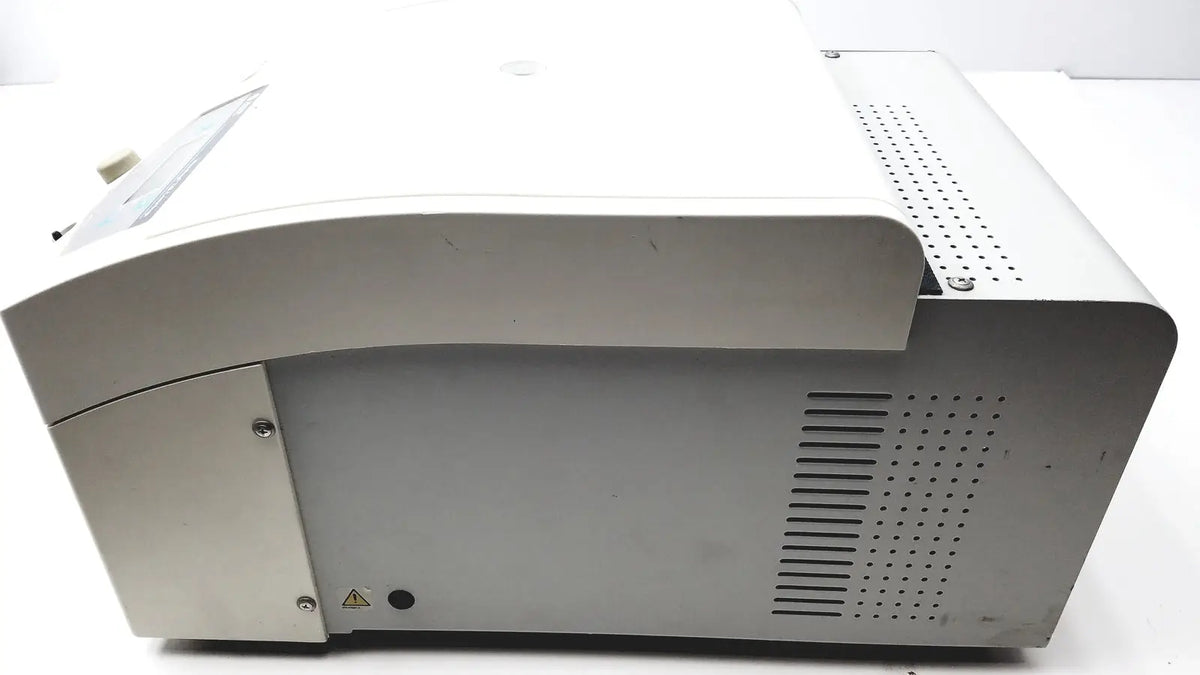 Silver-gray plastic beckman coulter microfuge 22r centrifuge with curved top and perforated ventilation panels