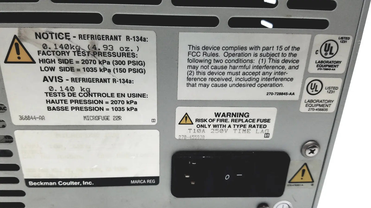 Silver metallic beckman coulter microfuge 22r centrifuge with black warning labels and certification stickers