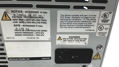 Silver metallic beckman coulter microfuge 22r centrifuge with black warning labels and certification stickers