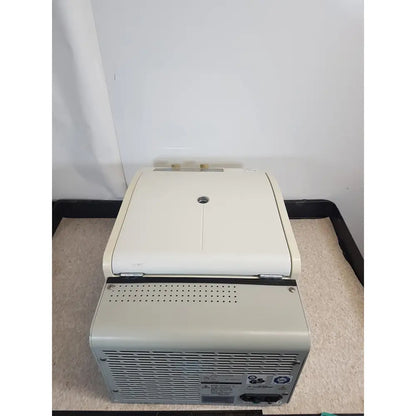 Beige plastic beckman coulter refrigerated centrifuge microfuge 22r with hinged lid and ventilation grilles on sides