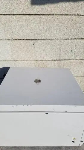 White rectangular beckman coulter spinchron dlx benchtop centrifuge outdoor unit with circular top vent