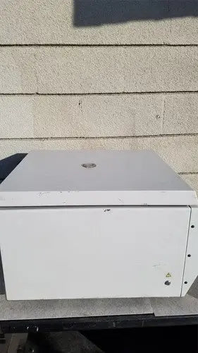 White rectangular metal benchtop centrifuge with worn surface and logo from beckman coulter spinchron dlx series