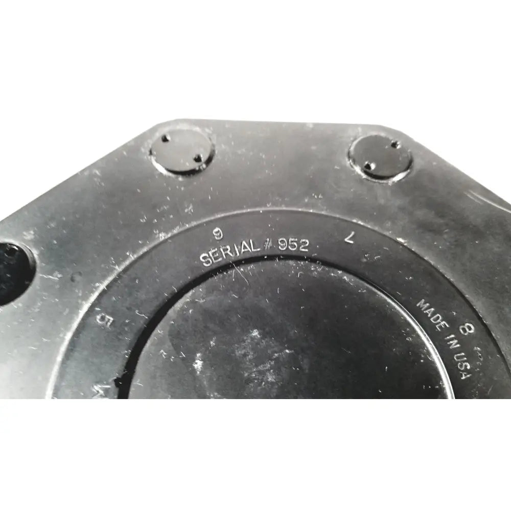 Black metal flange with engraved serial number 952 and made in usa on beckman coulter ultracentrifuge unit
