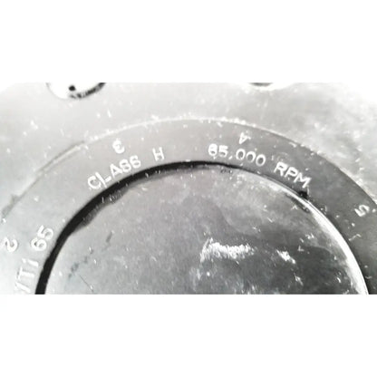 Black circular dial with engraved white text class h and 65,000 rpm on beckman coulter ultracentrifuge unit