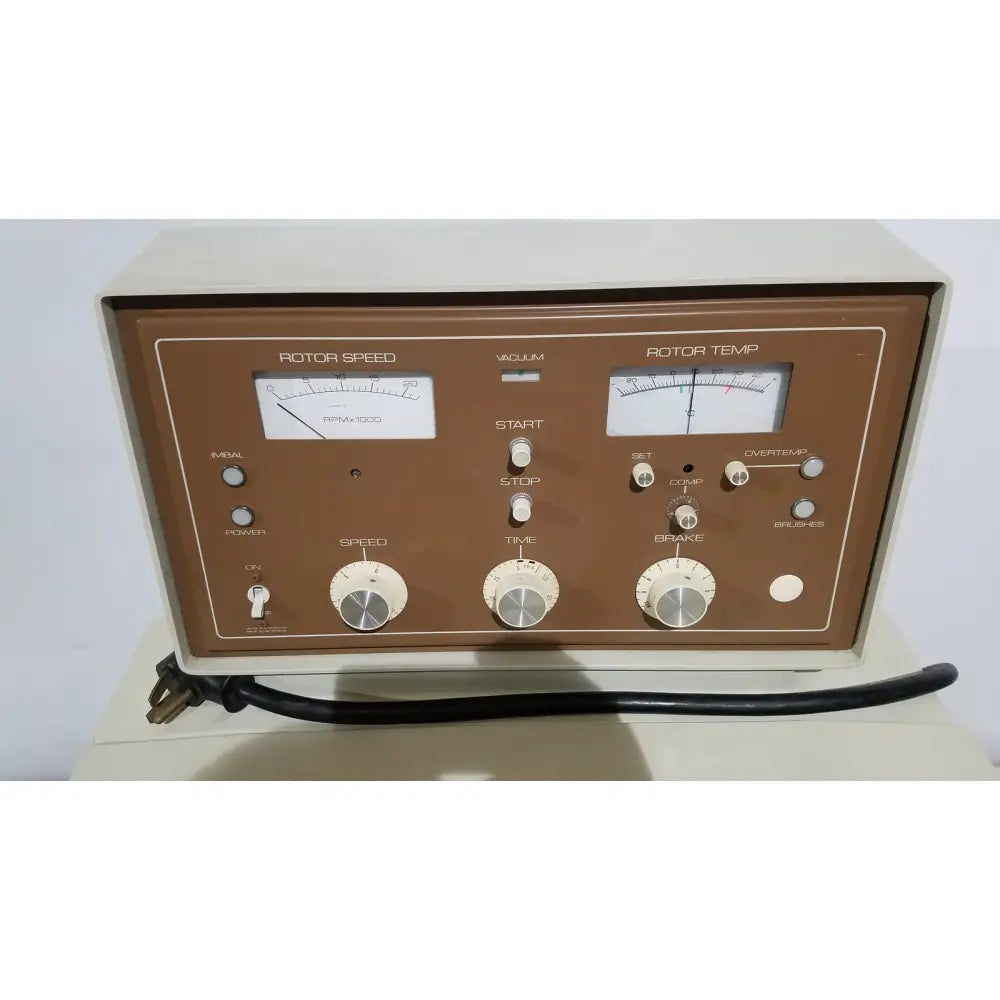 Brown and cream-colored beckman j2-21 refrigerated centriifuge with analog gauges and control switches for rotor speed and temperature