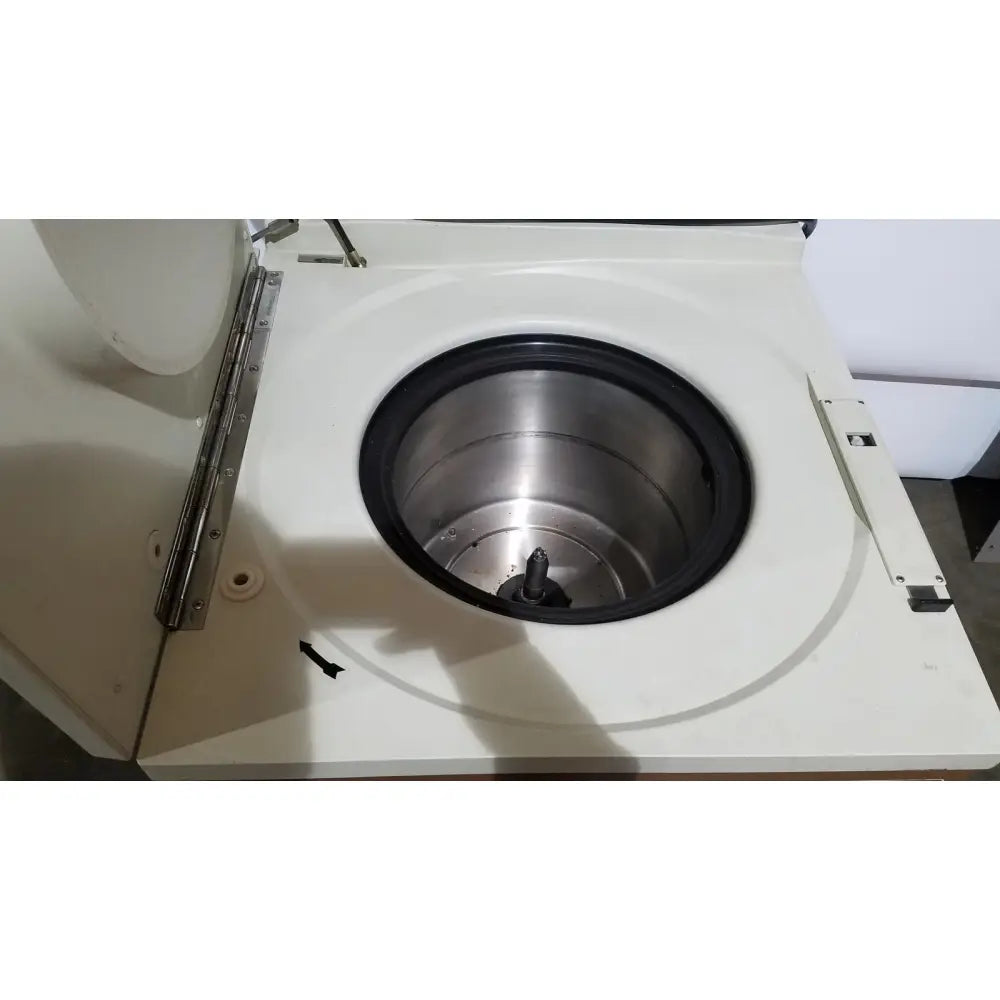 White laboratory refrigerated centriifuge beckman j2-21 with stainless steel rotor and black rubber seal