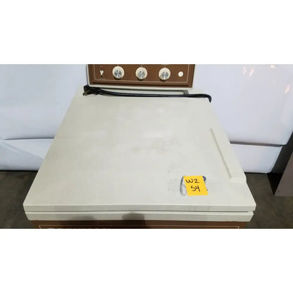 Cream-colored beckman j2-21 refrigerated centriifuge with brown control panel, three dials, and black power cord
