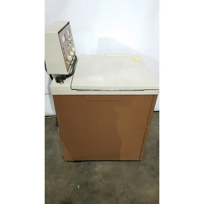 Beige and brown industrial j2-21 refrigerated centriifuge with control panel on top for laboratory refrigeration use