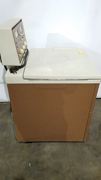Beige and brown industrial j2-21 refrigerated centriifuge with control panel on top for laboratory refrigeration use