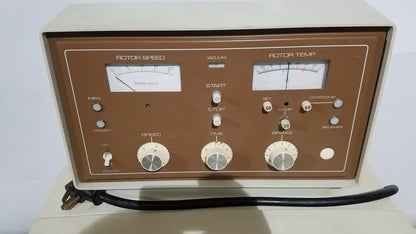Brown and cream-colored beckman j2-21 refrigerated centriifuge with analog gauges and control switches for rotor speed and temperature