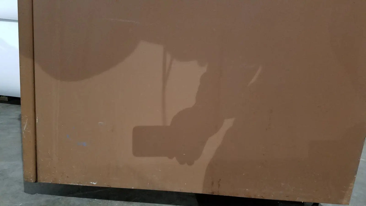 Brown slightly reflective cabinet door with visible wear on beckman j2-21 refrigerated centrifuge for laboratory use