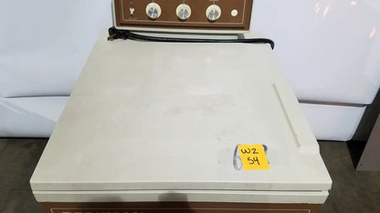 Cream-colored beckman j2-21 refrigerated centriifuge with brown control panel, three dials, and black power cord