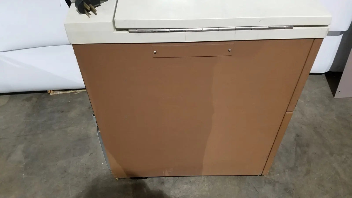 Tan metal cabinet with white top and silver hinge of beckman j2-21 refrigerated centriifuge for laboratory use