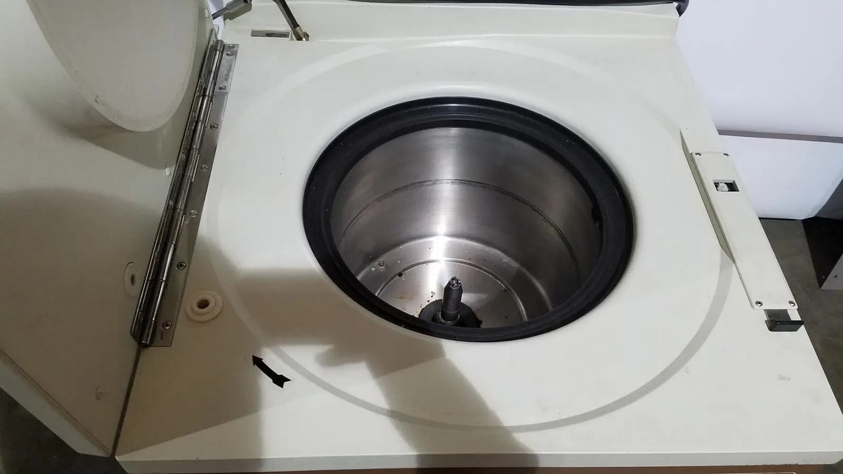 White laboratory refrigerated centriifuge beckman j2-21 with stainless steel rotor and black rubber seal