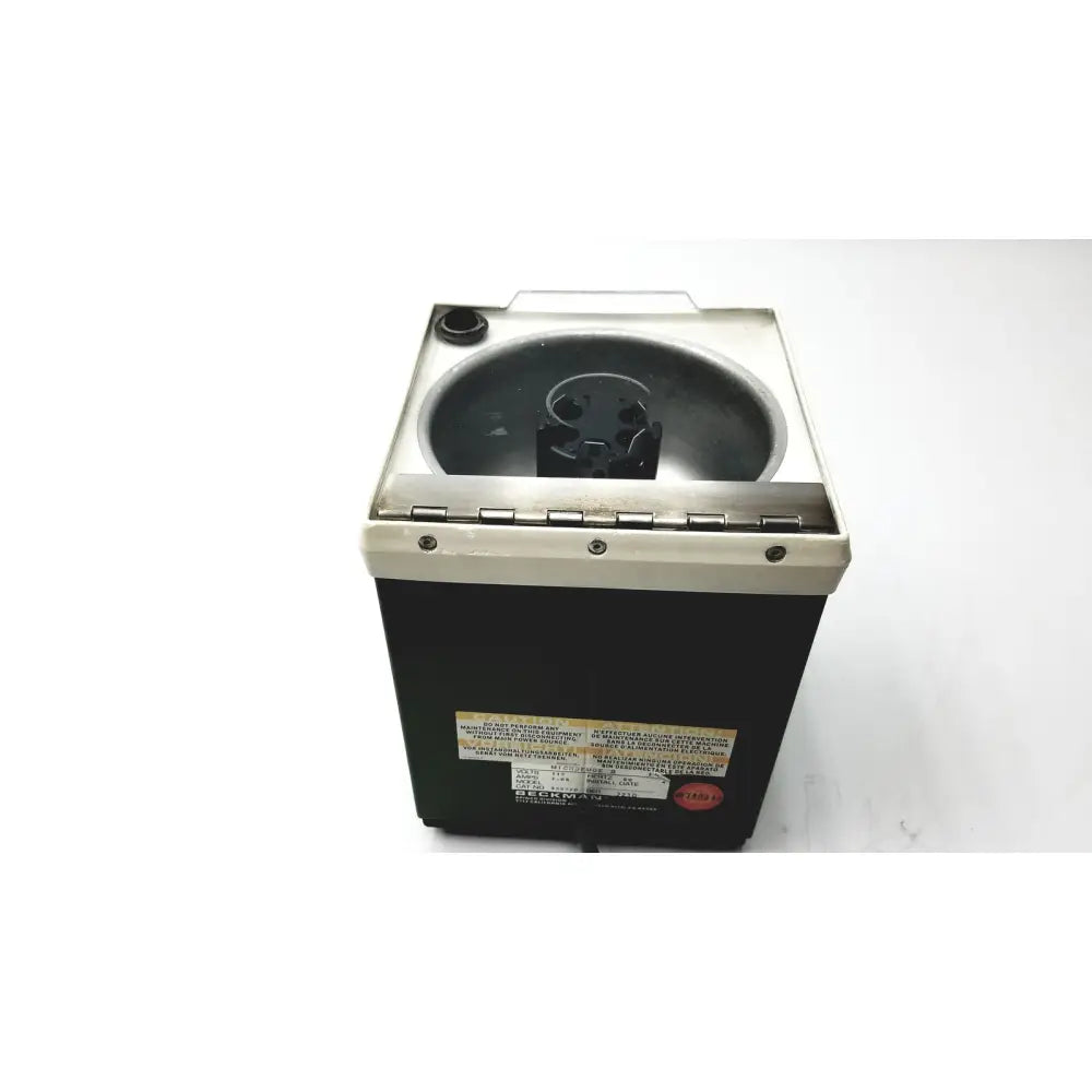 Black and silver beckman microfuge with stainless steel basin and 6-position rotor for reuse medical applications