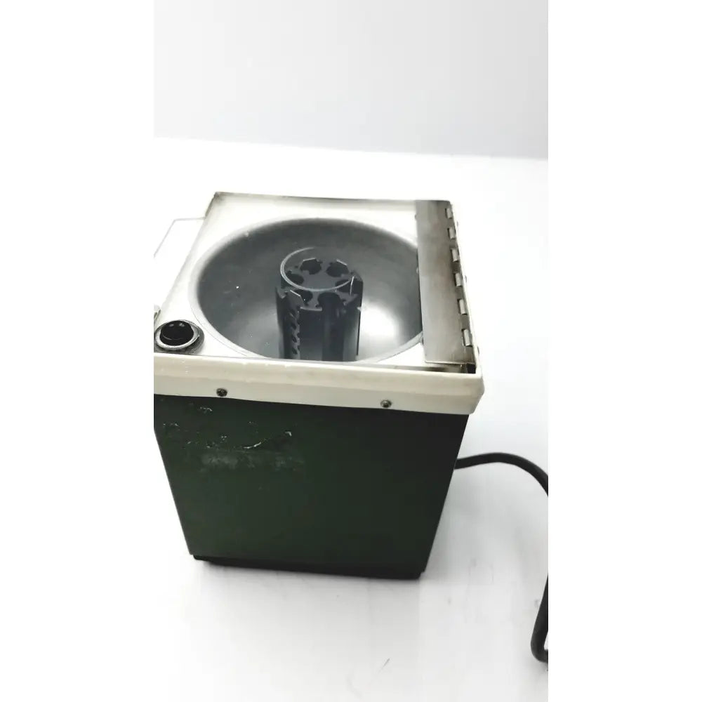 Dark green and cream beckman microfuge with metallic interior basin and 6-position rotor for reuse medical applications