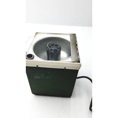 Dark green and cream beckman microfuge with metallic interior basin and 6-position rotor for reuse medical applications
