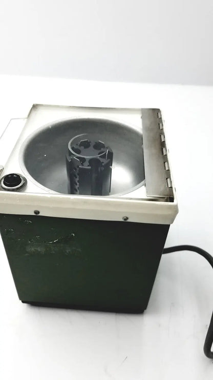 Dark green and cream beckman microfuge with metallic interior basin and 6-position rotor for reuse medical applications