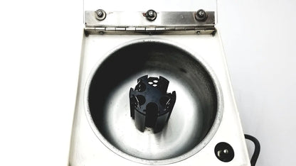 White laboratory centrifuge beckman microfuge with a black 6-position rotor designed for reuse medical applications