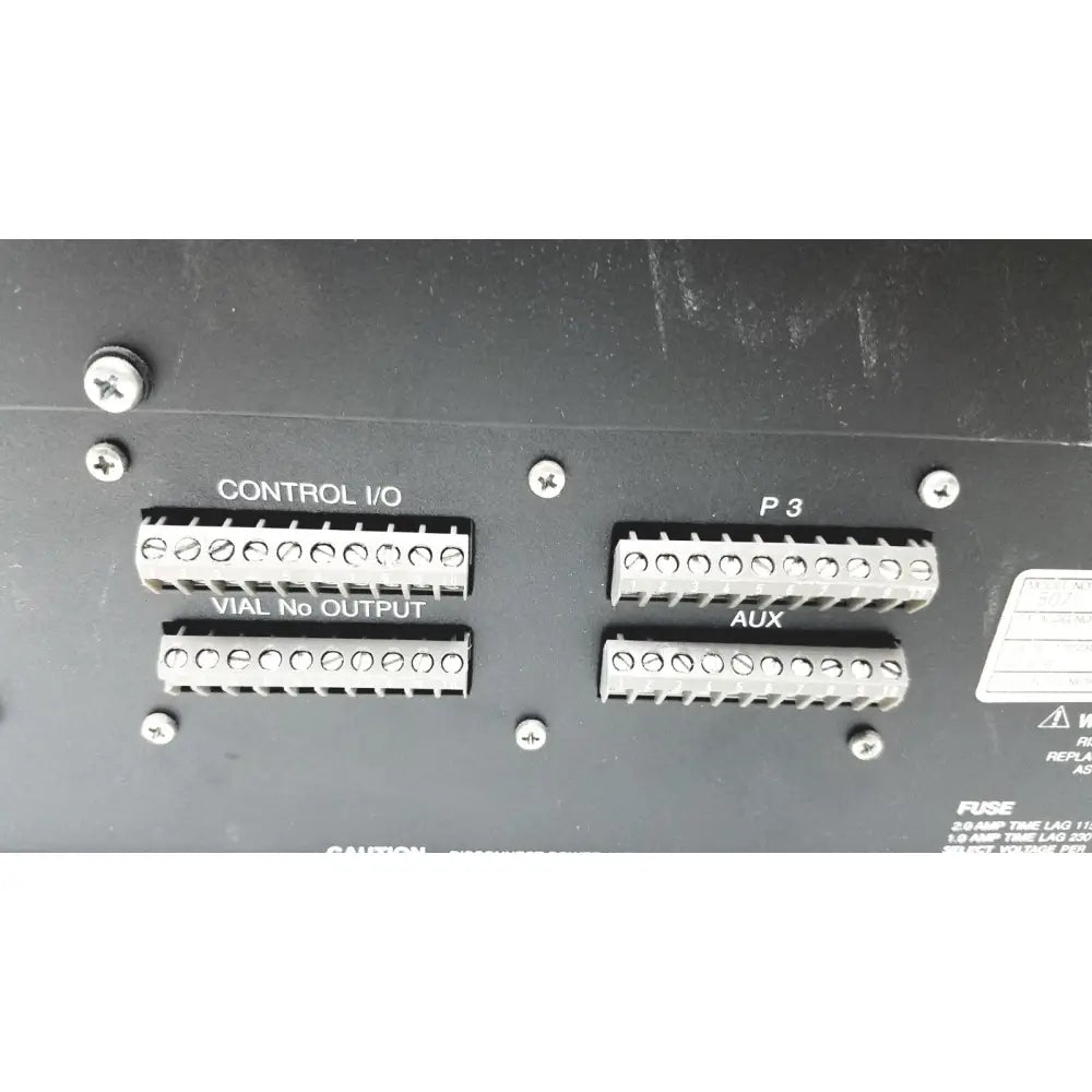 Black panel with four silver terminal blocks on the back of beckman system gold autosampler 507 for hplc laboratory reuse medical use