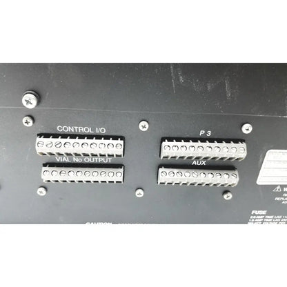 Black panel with four silver terminal blocks on the back of beckman system gold autosampler 507 for hplc laboratory reuse medical use