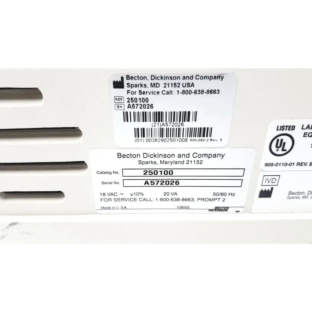 White plastic industrial electrical enclosure with labels and barcodes for becton dickinson microprobe processor laboratory equipment