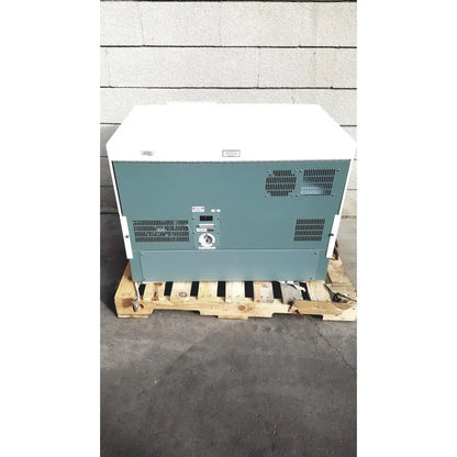 White and teal becton dickinson facscalibur flow cytometer rear side showing ventilation grilles control panel and circular dial