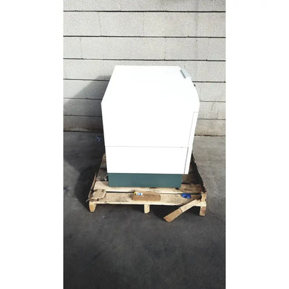 White and teal two-drawer office printer on wooden pallet as part of becton dickinson facscalibur flow cytometer setup