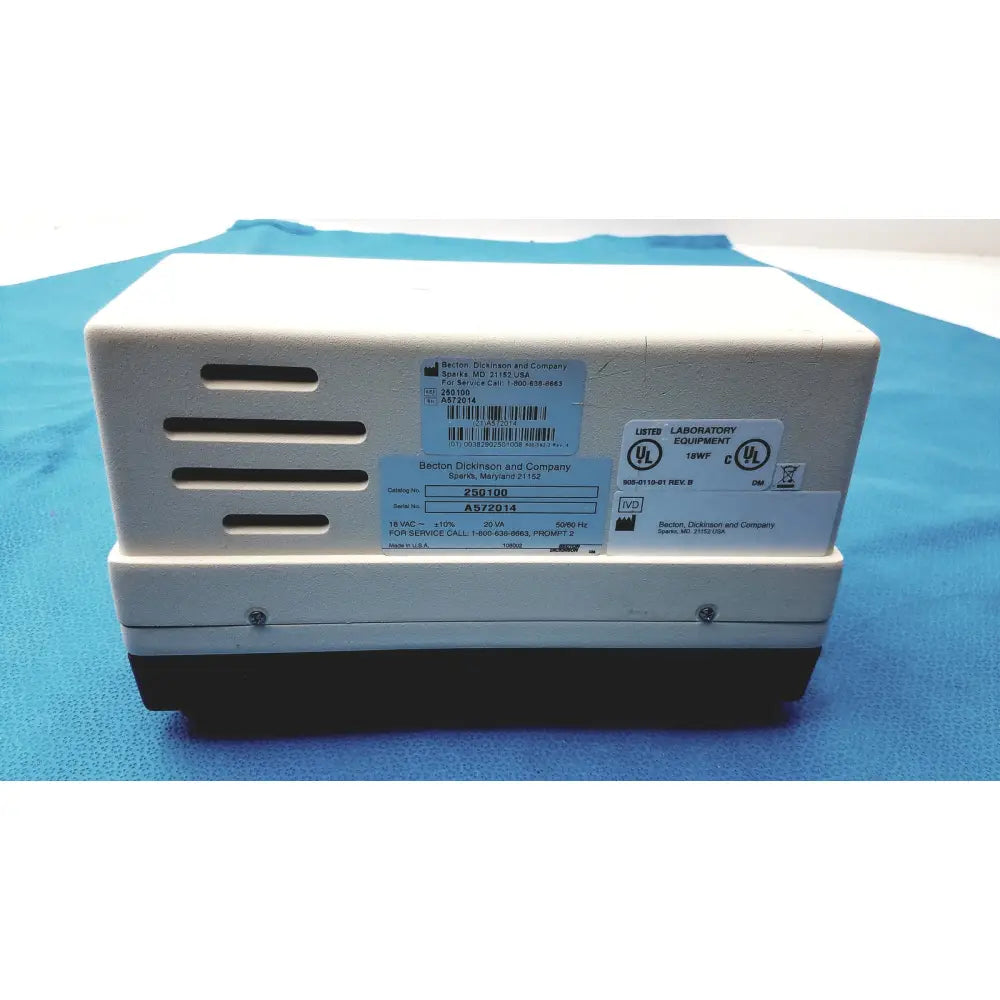 White and black becton dickinson microprobe 250100 processor with ventilation slots and jerome power supply unit