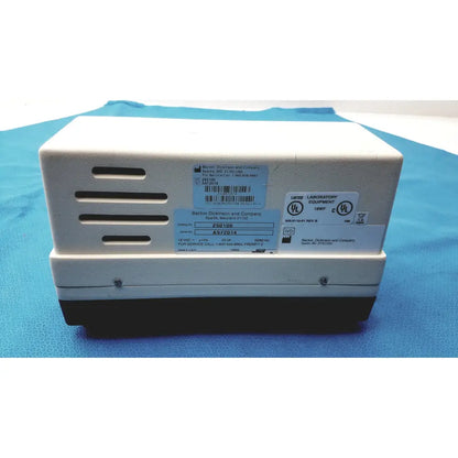 White and black becton dickinson microprobe 250100 processor with ventilation slots and jerome power supply unit