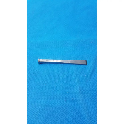 Benn stainless surgical instrument 18m featuring a silver stainless metal chisel with a flat curved blade and textured handle