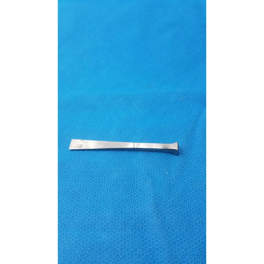 Silver metal flathead pry bar with slightly curved end benn stainless surgical instrument 18m stainless surgical instrument