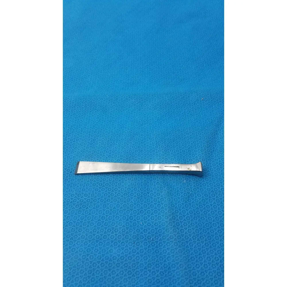 Silver benn stainless surgical instrument 18m with flat rectangular blade and curved handle made of stainless steel