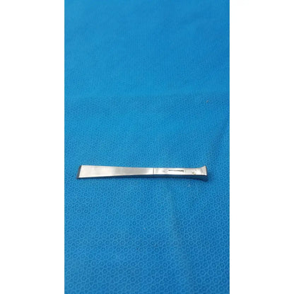 Silver benn stainless surgical instrument 18m with flat rectangular blade and curved handle made of stainless steel