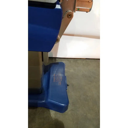 Blue plastic foot pedal with engraved caution label for berchtold d850 operon surgical table control