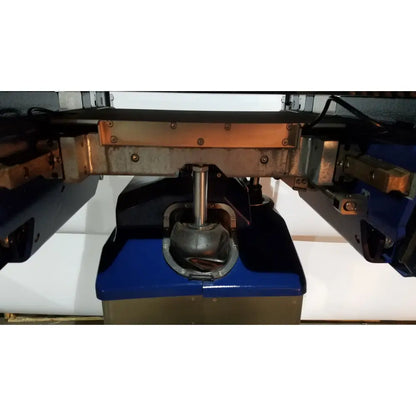 Blue berchtold d850 operon surgical table with metallic central shaft and copper-colored structural components
