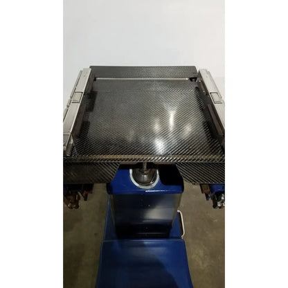 Berchtold d850 operon surgical table with carbon fiber workbench, metallic side rails, and blue base for medical use