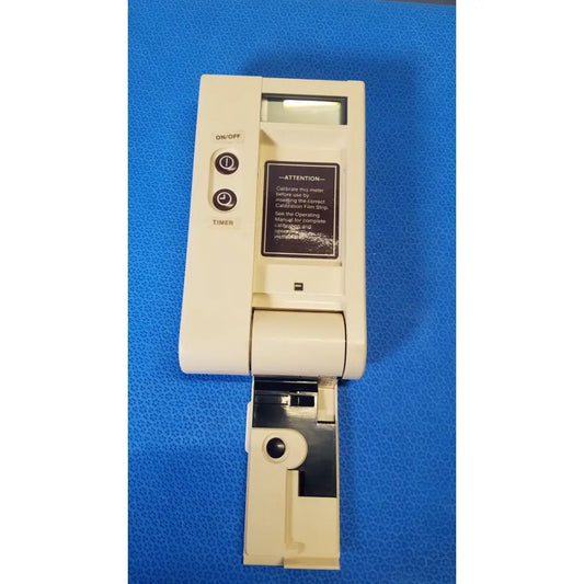 Beige plastic bio-dynamics accu-chek blood glucose monitor with black label and circular on/off and timer buttons