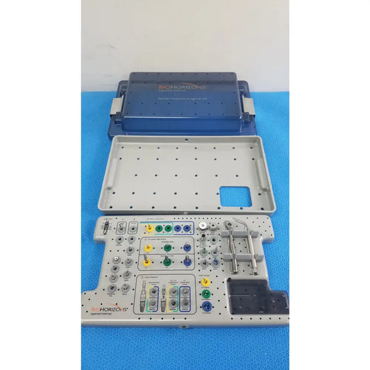 Bio horizons tapered internal dental implant surgical kit in blue and gray with organized trays holding colorful-handled tools