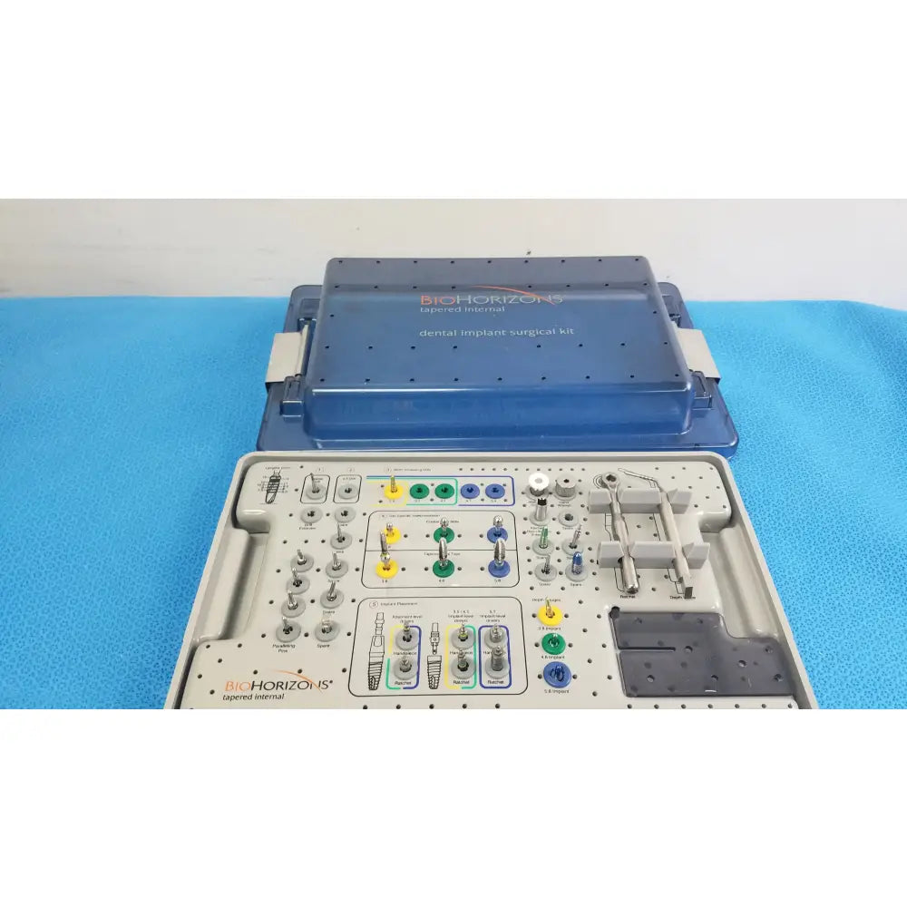 Bio horizons tapered internal dental implant surgical kit in blue and gray with organized compartments and colored tools