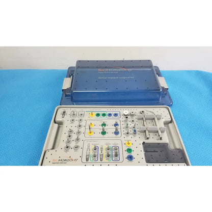 Bio horizons tapered internal dental implant surgical kit in blue and gray with organized compartments and colored tools