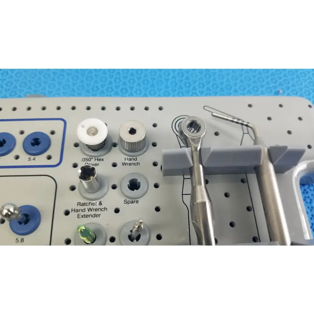 Silver surgical hand wrench with hexagonal socket and textured grip for bio horizons tapered internal dental implant kit