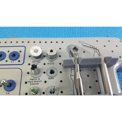 Silver surgical hand wrench with hexagonal socket and textured grip for bio horizons tapered internal dental implant kit