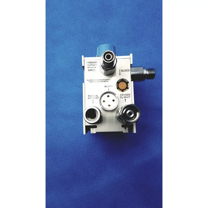 Silver bio-med devices 2001 air oxygen blender with labeled ports and blue top cap for medical respiratory gas mixing