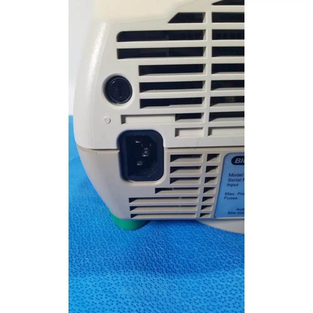 Beige plastic bio-rad mycycler thermal cycler 580br back side with black power port ventilation slats and blue label
