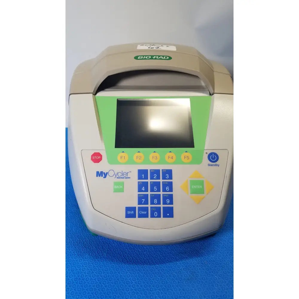 Beige and green bio-rad mycycler thermal cycler with digital display numeric keypad and power indicator for PCR use