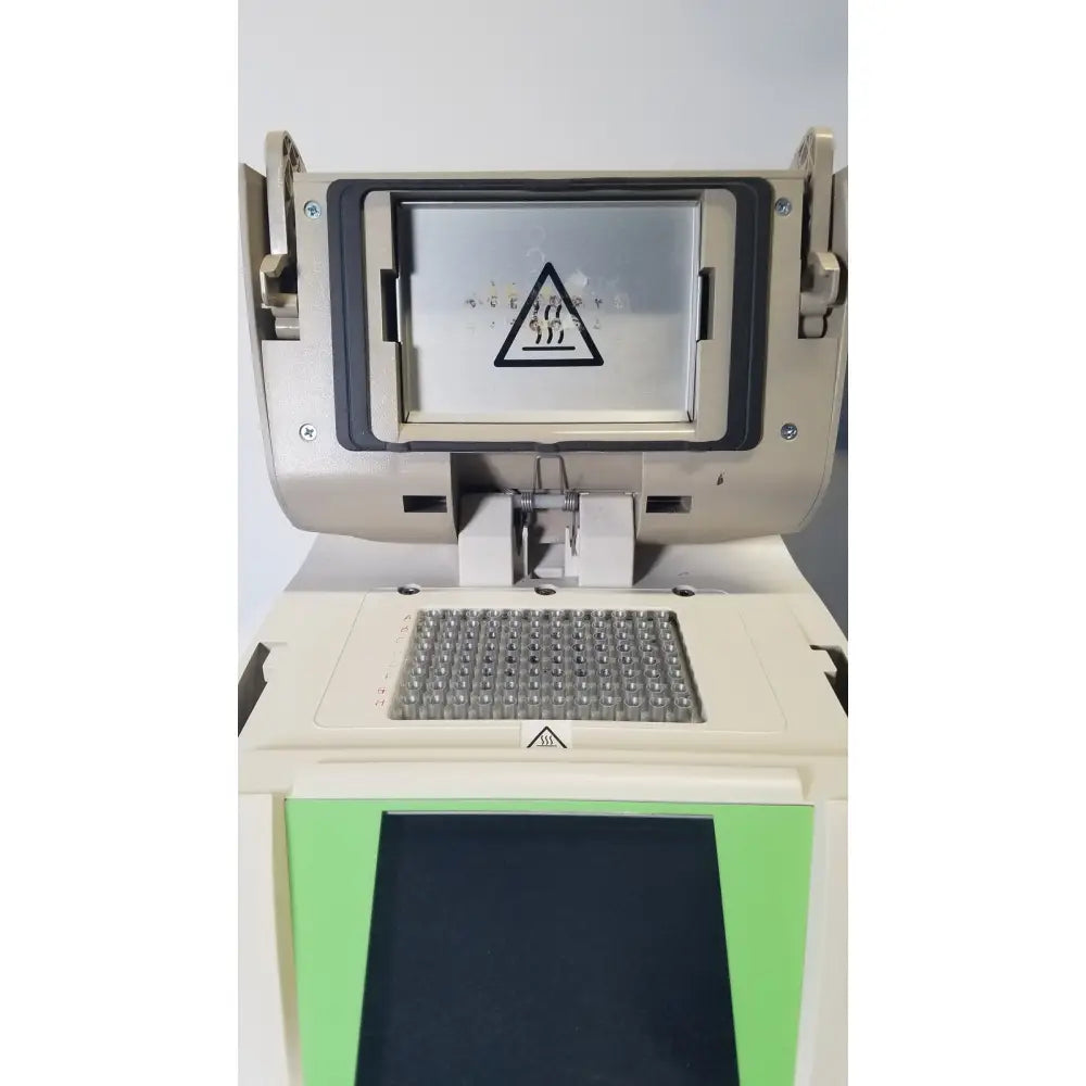 Beige and green bio-rad mycycler thermal cycler 580br microplate reader with digital display showing warning triangle