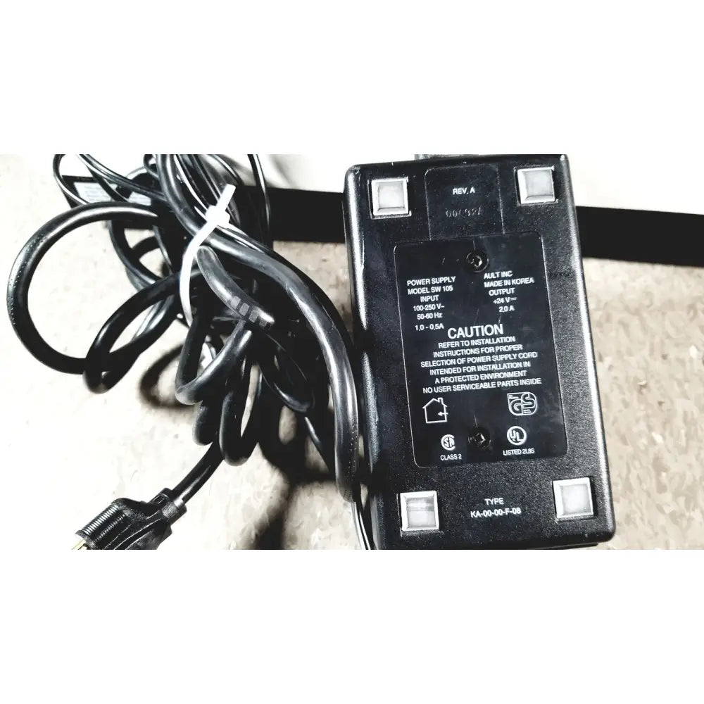 Black plastic power adapter with coiled cable and white zip tie for Bio-Tek Instruments elx800 universal microplate reader
