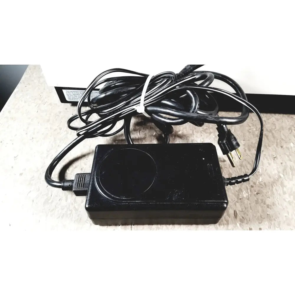 Black plastic power adapter with coiled cord for bio-tek instruments elx800 universal microplate reader 24vdc 40 watt